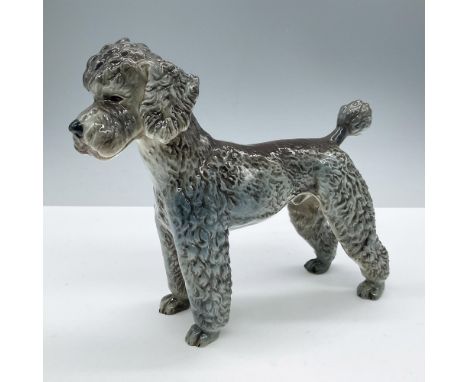 Glazed finish. Depicts a standing dog. Goebel backstamp. Marked 1968. Issued: 1968Dimensions: 7''L x 2.5''W x 6.5''HManufactu