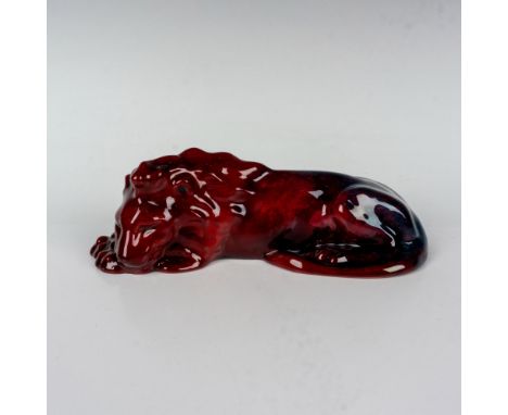 Rare red and blue flambe glazed study of a lion resting. Royal Doulton Flambe marked. Issued: c. 1918-1936Dimensions: 7.25"L 