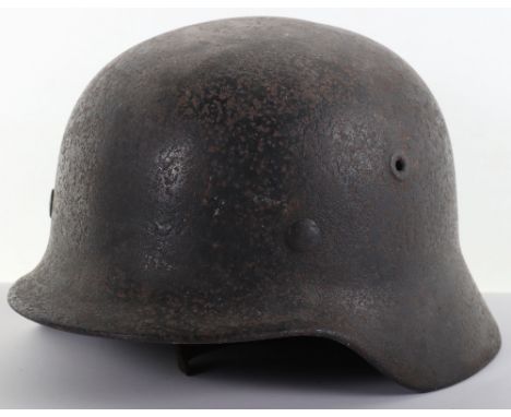 German Wehrmacht M-40 Pattern Steel Combat Helmet, being a semi relic barn find example which has a dark black paint finish t