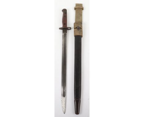 British RAF Regiment 1907 Bayonet, with the wooden slab grips being stamped “RAF REGT”. Leather scabbard with steel mounts. W