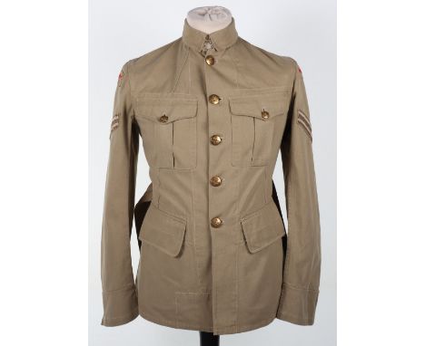 Royal Air Force Tropical KD Tunic, pre-war closed collar pattern, complete with red cloth eagles and brass buttons. Large pat