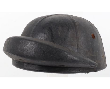 Scarce Early Pattern British Tankers Helmet, blackened cloth covered cork helmet with large upturned padded protection piece.