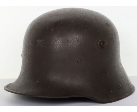 Imperial German M-17 Steel Combat Helmet, good untouched example retaining much of its original field grey / green paint fini