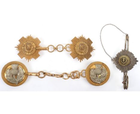 Scots Guards Officers Cloak Chains, gilt metal examples in the form of Regimental star with linked chain and four lug fitting