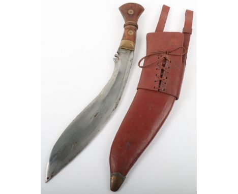 Copy of an Indian Issue 1917 Dated Gurkha Kukri, with wooden grips having brass top mount plate. Curved single edged blade wi