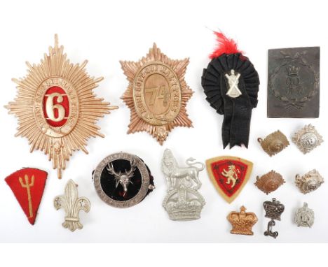 Grouping of British Military Badges, including a made up 6th Dragoon Guards helmet plate, white metal circlet for the “DERBYS