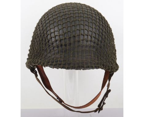 WW2 American Fixed Bale M1 Steel Combat Helmet, the shell is painted in the typical dark green rough textured paint finish. G