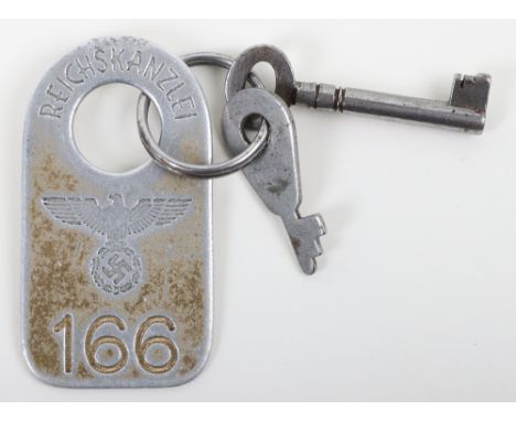 Key and Fob from the Toilet in the Reich Chancellery Liberated in 1945, an alloy key fob impressed with NSDAP political eagle