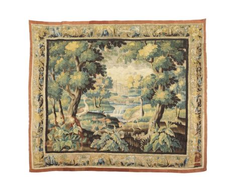 AUBUSSON VERDURE TAPESTRYFRANCE, LATE 17TH/EARLY 18TH CENTURY woven with two birds amidst trees, with river and buildings in 
