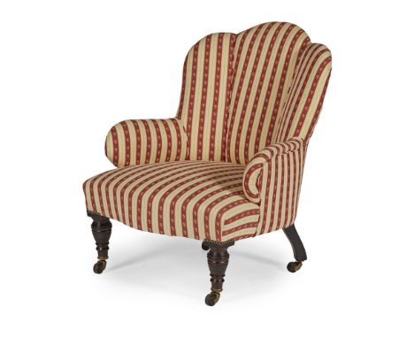 VICTORIAN UPHOLSTERED ARMCHAIR19TH CENTURY the sectioned back with arched top above low scroll arms and serpentine seat, rais