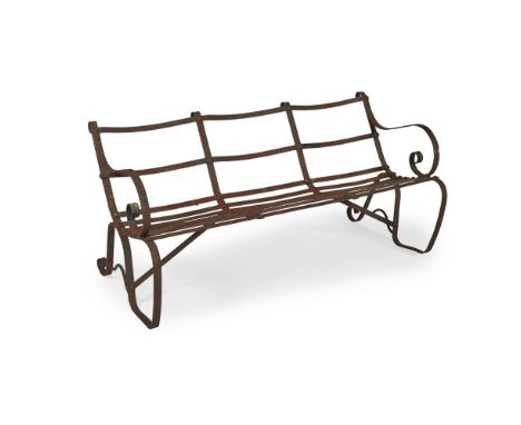 REGENCY WROUGHT IRON GARDEN BENCH19TH CENTURY with scrolled back, arms and seat in iron strapwork, painted black150cm wide