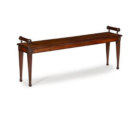 VICTORIAN MAHOGANY LONG BENCH19TH CENTURY in the Neoclassical style, the long rectangular seat with roll top ends, raised on 