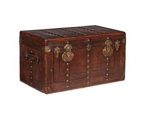 VICTORIAN LEATHER TRUNKLATE 19TH CENTURY in brown embossed leather with brass studded details and fittings, with leather hand