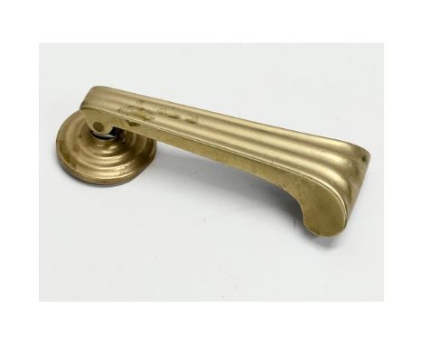 A Victorian brass door knocker. 17cm 