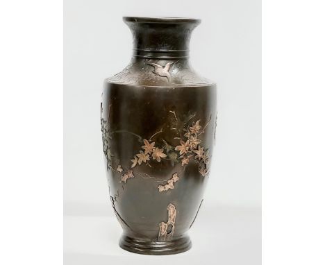 A large Late 19th Century Japanese bronze pot. Attributed too Miyabe Atsuyoshi. Decorated with relief birds in flight and lot
