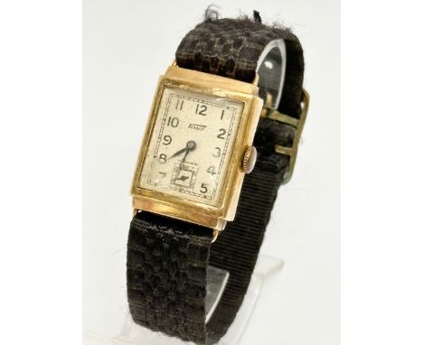 A vintage 9ct gold watch by Tissot. 