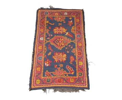 A vintage Middle Eastern hand knotted rug. 178x91cm 