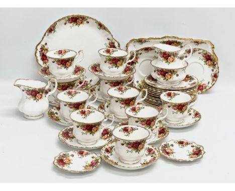 A 41 piece Royal Albert ‘Old Country Roses’ tea service. 10 cups, 12 saucers, 2 milk jugs, sugar bowl, cake plate, sandwich s