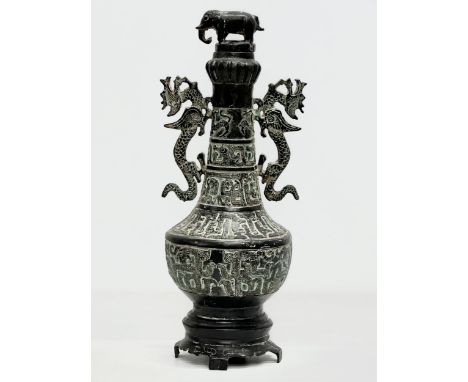 A large 19th Century Chinese bronze pot with lid. 34cm 