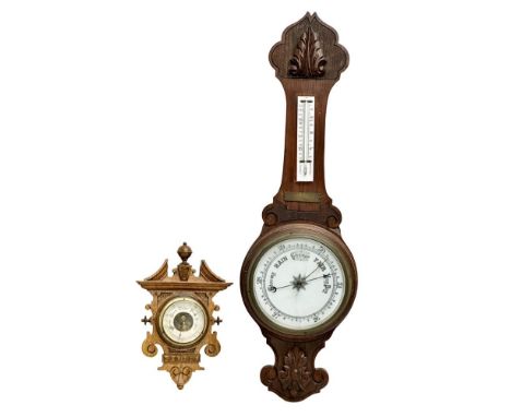 A Late Victorian oak barometer with an Early 20th Century oak barometer. 85cm 
