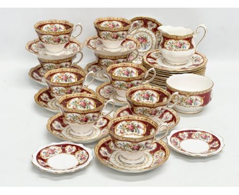 A 33 piece Royal Albert ‘Lady Hamilton’ tea service. 9 cups, 10 saucers, 10 sandwich plates, milk jug, sugar bowl, 2 Bon Bon 