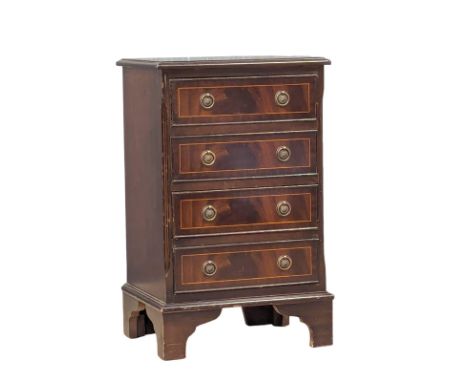 A Georgian style inlaid mahogany chest of drawers on bracket feet. 44.5x36.5x72cm 