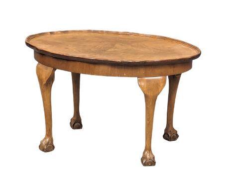 A vintage walnut coffee table on Ball and Claw feet. 73x49.5x43cm 