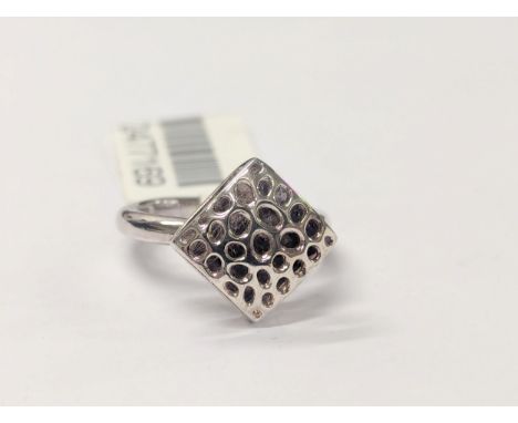 A silver ring. UK size J/K 