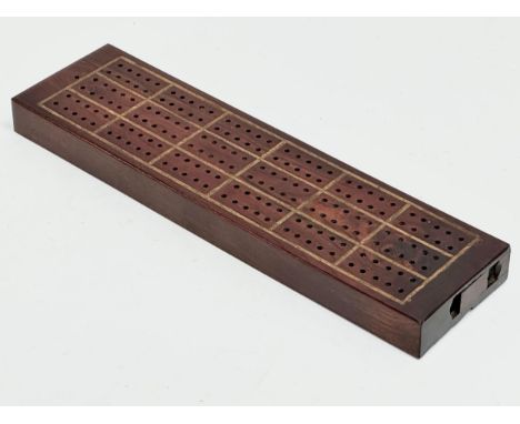 A 19th Century rosewood cribbage board. 27.5x7.5x2.5cm 