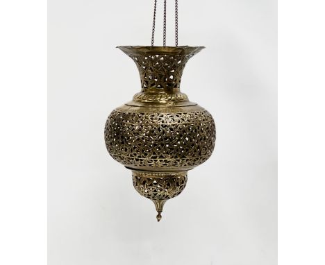 An Early 20th Century Moroccan pierced brass Mosque ceiling light. Circa 1900.  21x34cm. 63cm including chain. 