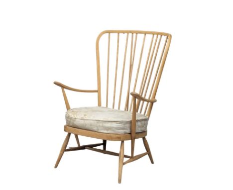 An Ercol Blonde Mid Century elm and beech armchair. Model 914. 