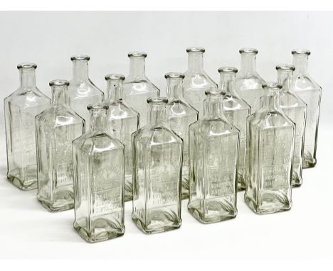 A collection of 15 vintage The Old Bushmill’s Distillery Triple Distilled whiskey bottles. 24.5cm 