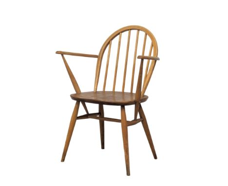 An Ercol Blonde elm and beech Mid Century armchair. Model 182. 