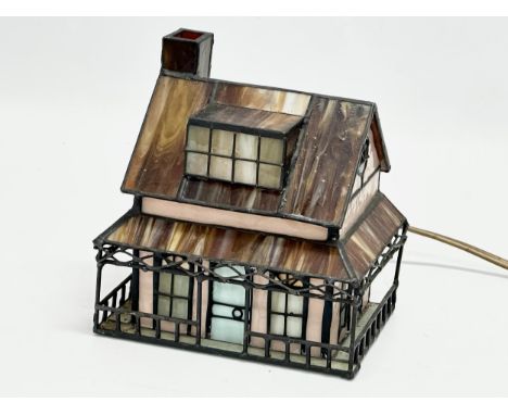 Christopher Wray, London. A Tiffany style stained glass light up house lamp by Christopher Wray. 15x12x15.5cm. 