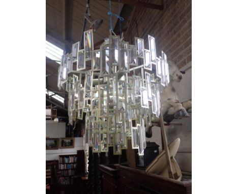 A PAIR OF MODERN CHANDELIERS BY MW LIGHTING prismatic lustres within a metal frame (untested)