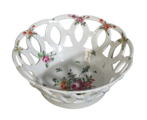 A WORCESTER PIERCED BON BON DISH 18th century, of lobed circular outline decorated with handpainted flower sprigs throughout 
