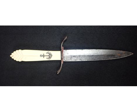 A FRENCH NAVAL DAGGER 24cm, with celluloid handle.Note: You must be over 18 to purchase this item. By bidding on this Lot you
