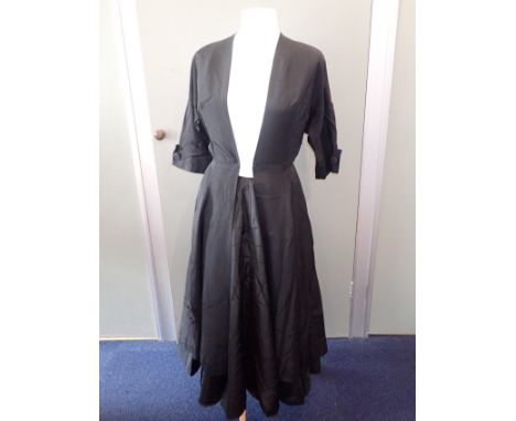 A VINTAGE 1950s QUILTED CIRCLE SKIRT a vintage flock-printed nylon net petticoat, and a 1950s fitted top coat by McKettrick (