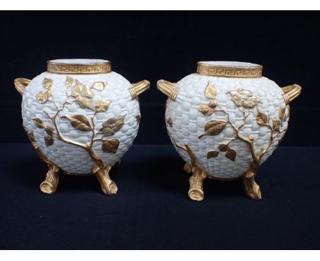 A PAIR OF ROYAL WORCESTER BASKET WEAVE AND GILT VASES of flattened ovoid form, with naturalistic moulded and gilt flowering b