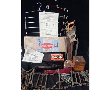 A VINTAGE IRON FIRE ESCAPE LADDER a butcher's saw, another saw, a 1960s 'Kwik-Paster', a Hallmarking Act notice, and other it