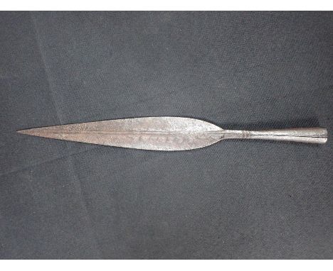 AN ANTIQUE AFRICAN IRON SPEAR possibly Masaai, lacking wooden shaft, 39cm long.Note: You must be over 18 to purchase this ite