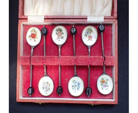A CASED SET OF SILVER AND FLORAL ENAMEL SPOONS with coffee bean terminals