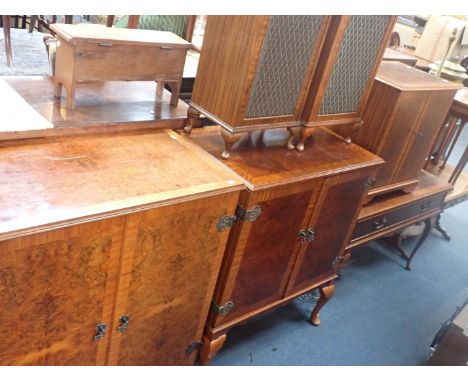 A SUITE OF REPRODUCTION FIGURED WALNUT FUNITURE comprising TV cabinet, small sofa table, nest of tables, a round coffee table