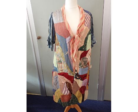 A 1930s 'CRAZY QUILT' STYLE PATCHWORK DRESSING GOWN or housecoat, made from various silks, crepe de Chine, etc (some damage)