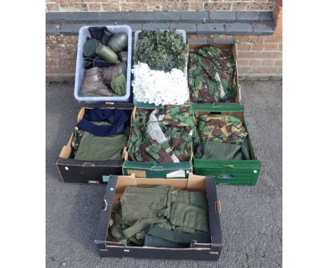 A LARGE QUANTITY OF ARMY SURPLUS ITEMS to include kit bags, camouflage nets, and others