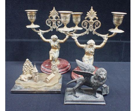 A PAIR OF CLASSICAL STYLE FIGURAL CANDLEABRA a St Mark's lion, and another item