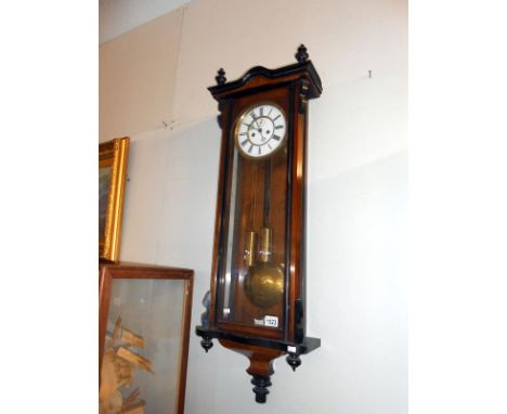 A mahogany twin weight Victorian Vienna wall clock