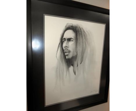 A signed framed and glazed portrait print of Bob Marley