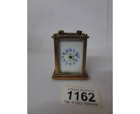 A miniature brass carriage clock marked Mignon, Germany