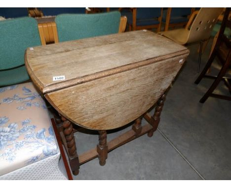 An oak barley twist gate leg table